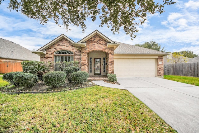 front of property with a garage and a front yard