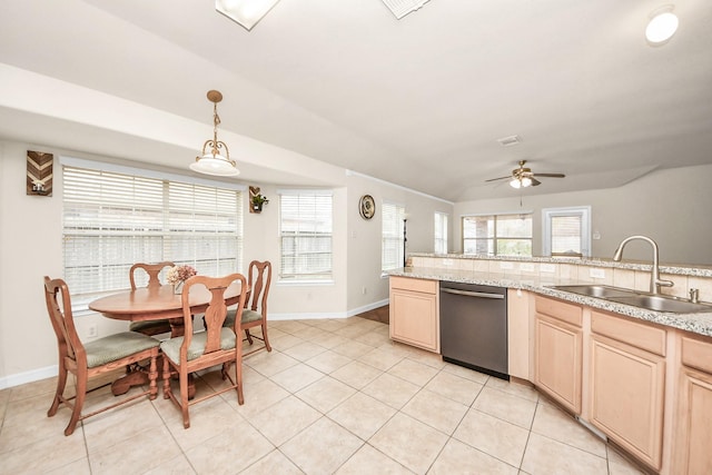 kitchen featuring dishwasher, sink, hanging light fixtures, light tile patterned floors, and light brown cabinets