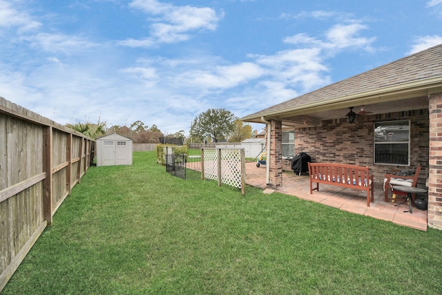 view of yard featuring an outbuilding, a fenced backyard, a patio, and a shed