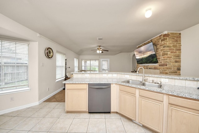 kitchen with light tile patterned floors, plenty of natural light, a ceiling fan, and a sink