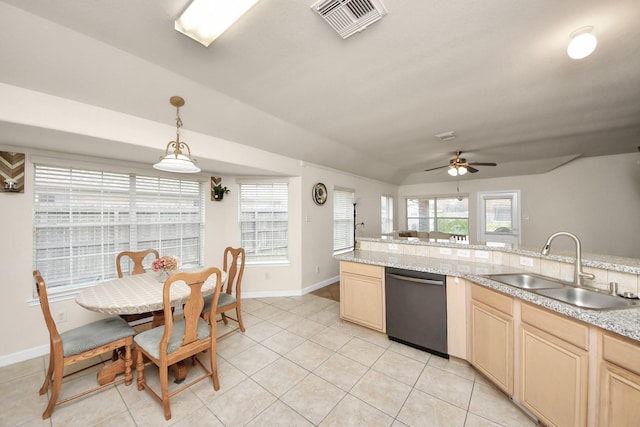 kitchen featuring light tile patterned floors, visible vents, hanging light fixtures, stainless steel dishwasher, and a sink