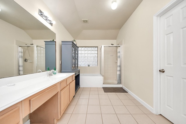 full bathroom featuring visible vents, a stall shower, vaulted ceiling, vanity, and tile patterned floors