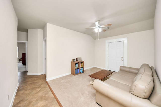 living room featuring a ceiling fan, light carpet, and baseboards