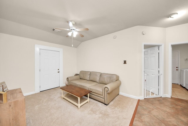 living room with baseboards, visible vents, vaulted ceiling, and a ceiling fan