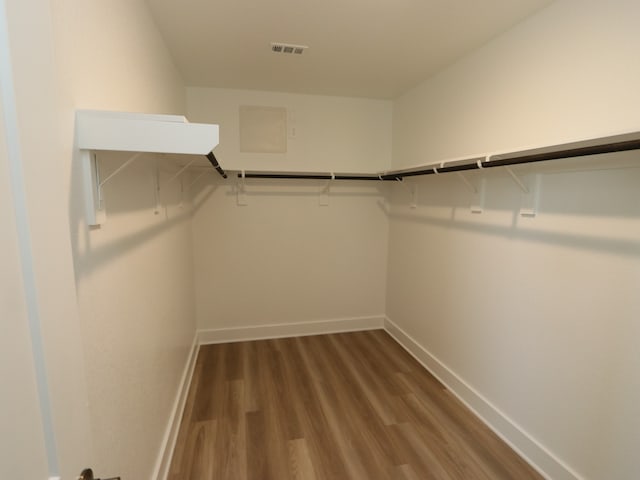 17343 Silver Birch Ct, New Caney, TX 77357 - walk in closet featuring wood finished floors