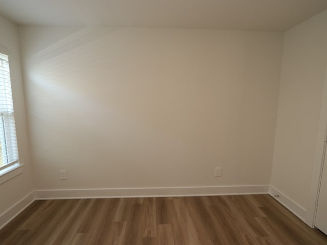 17343 Silver Birch Ct, New Caney, TX 77357 - spare room with dark wood finished floors and baseboards
