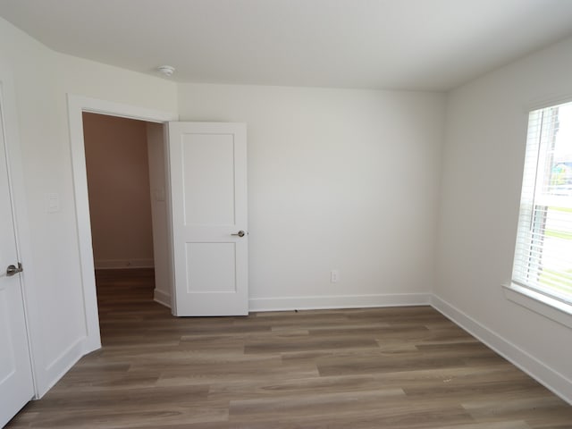 17343 Silver Birch Ct, New Caney, TX 77357 - spare room with plenty of natural light, light wood-style floors, baseboards, and a smoke detector