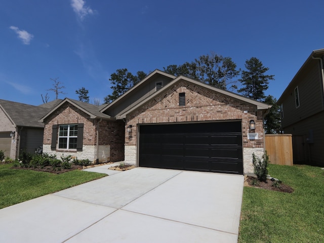 17343 Silver Birch Ct, New Caney, TX 77357 - ranch-style home with brick siding, concrete driveway, a garage, a front lawn, and stone siding