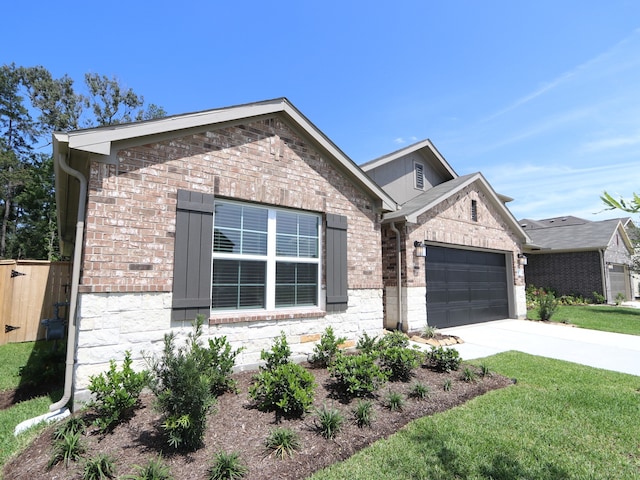 17343 Silver Birch Ct, New Caney, TX 77357 - view of front of property with brick siding, a garage, and driveway