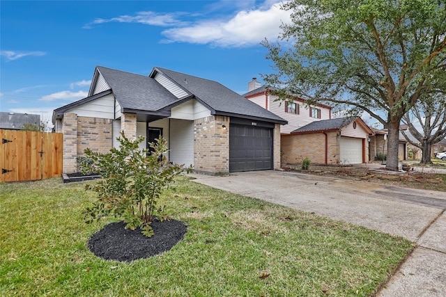 view of front of house with a front lawn and a garage