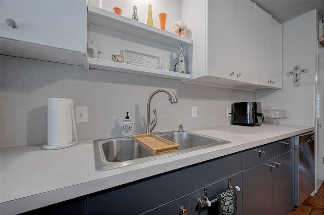 kitchen featuring white cabinetry, sink, and dishwasher