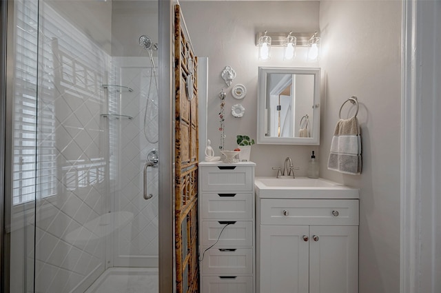 bathroom featuring vanity and an enclosed shower