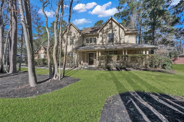 country-style home with a front lawn and covered porch