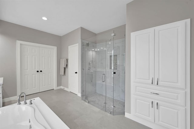 bathroom with separate shower and tub