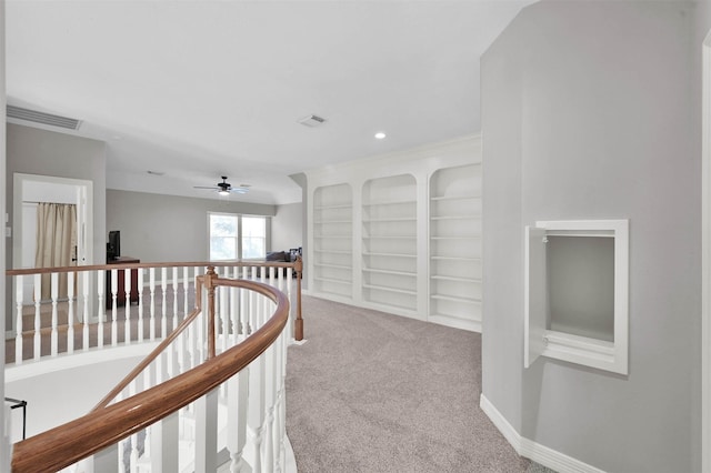 hallway with light carpet