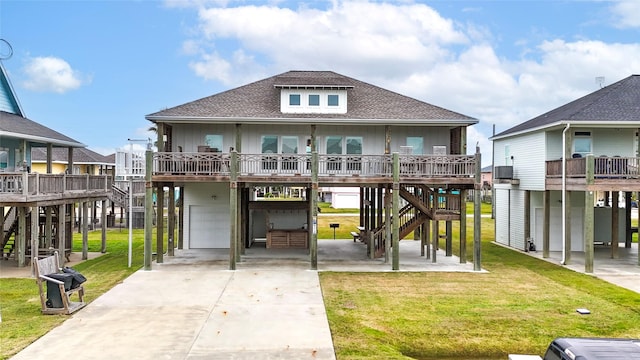 back of house with a yard and a garage