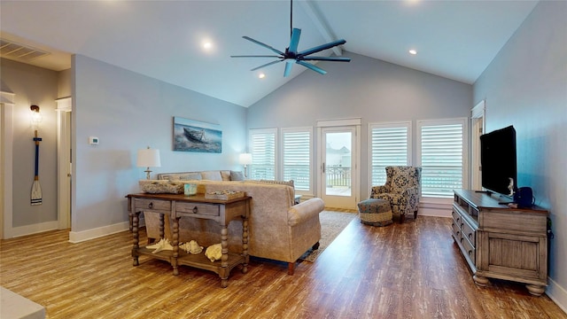 living room featuring vaulted ceiling with beams, hardwood / wood-style flooring, and ceiling fan