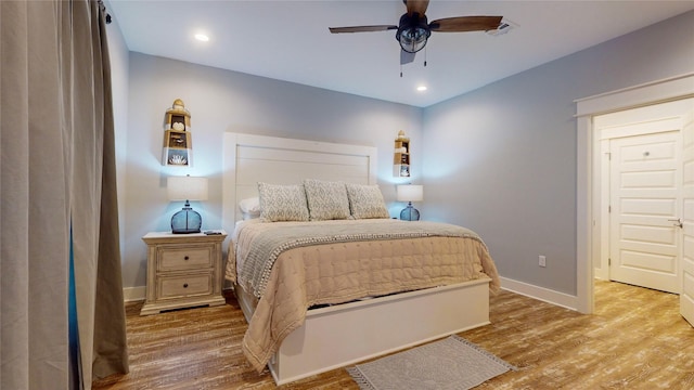 bedroom featuring ceiling fan and hardwood / wood-style flooring