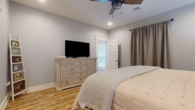 bedroom featuring ceiling fan and light hardwood / wood-style floors