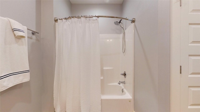 bathroom with shower / tub combo with curtain