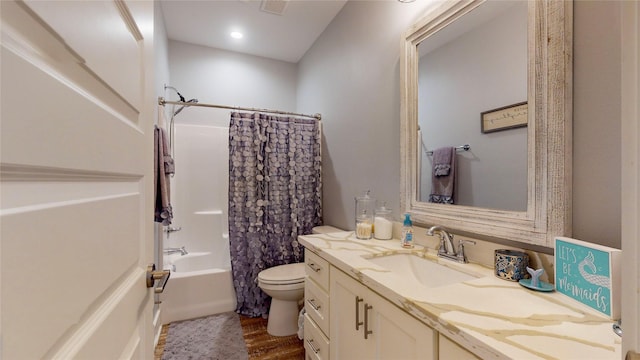 full bathroom featuring toilet, shower / bath combo, wood-type flooring, and vanity