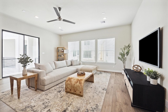 3037 Hicks St, Houston, TX 77007 - living room featuring ceiling fan and light hardwood / wood-style flooring