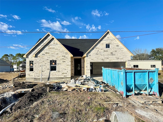 unfinished property with a garage