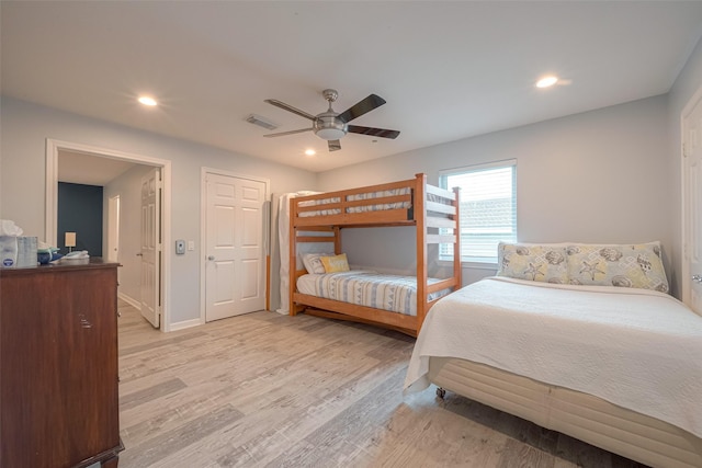 bedroom featuring ceiling fan and light hardwood / wood-style floors