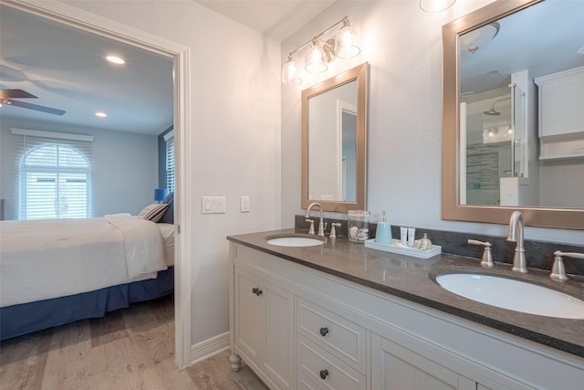 bathroom featuring ceiling fan, vanity, and hardwood / wood-style flooring