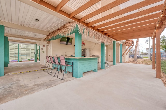 view of patio featuring a bar