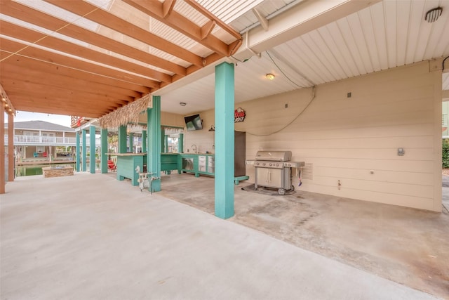 view of patio with sink and area for grilling