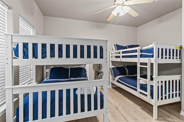 bedroom with ceiling fan and wood finished floors