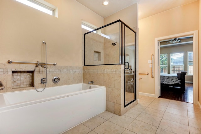 bathroom with independent shower and bath and tile patterned flooring