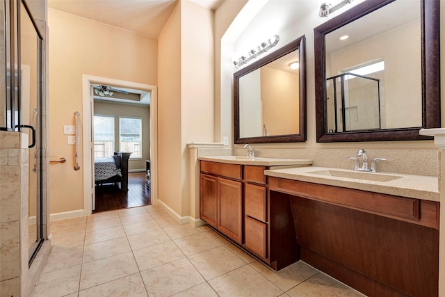 bathroom with vanity, tile patterned flooring, and a shower with door