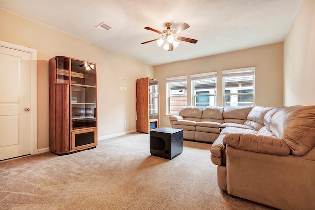 carpeted living room with ceiling fan