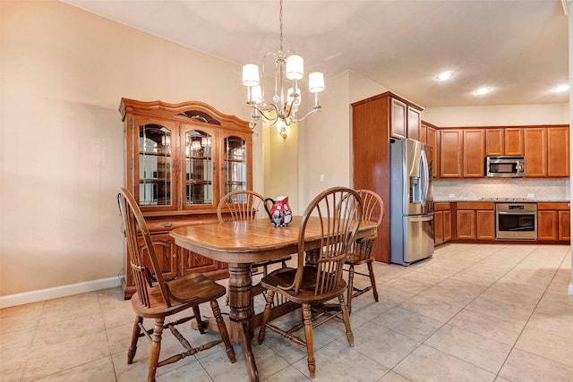 tiled dining space with an inviting chandelier