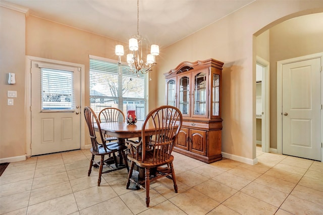 dining room featuring light tile patterned floors and a chandelier