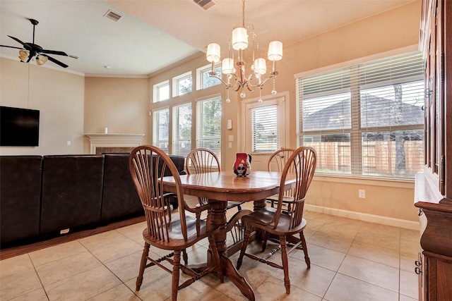 dining room featuring light tile patterned floors, ceiling fan with notable chandelier, and crown molding