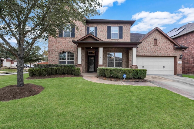 view of front of house featuring a garage and a front yard