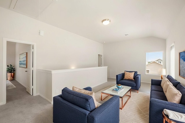 carpeted living room featuring lofted ceiling