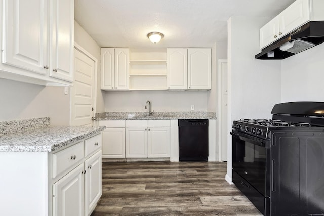 kitchen with dark wood-type flooring, white cabinets, a sink, under cabinet range hood, and black appliances