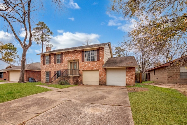 view of front of house with a front yard and a garage