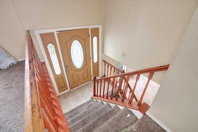 foyer featuring carpet