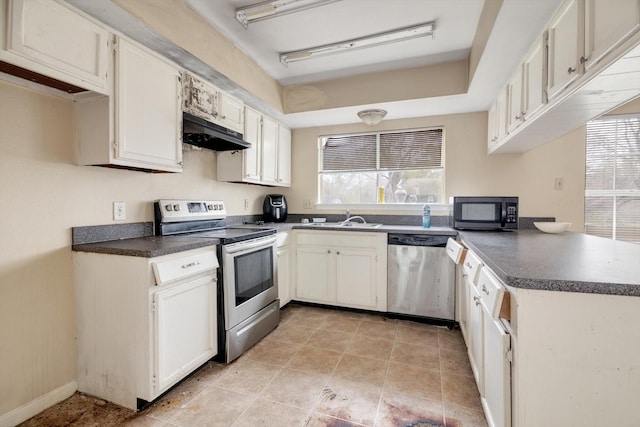 kitchen featuring white cabinets, appliances with stainless steel finishes, sink, and plenty of natural light