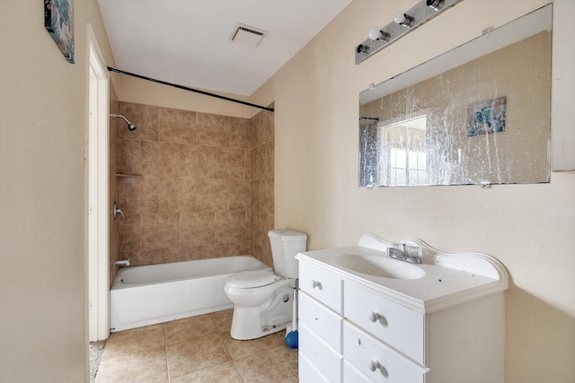 full bathroom with toilet, tiled shower / bath combo, tile patterned floors, and vanity