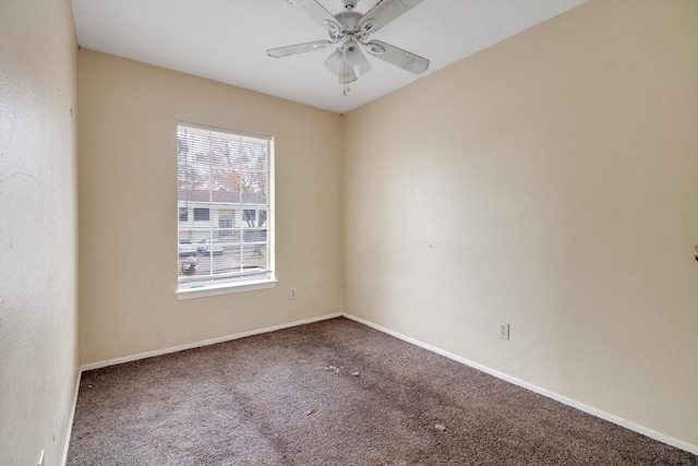 spare room with ceiling fan and carpet flooring