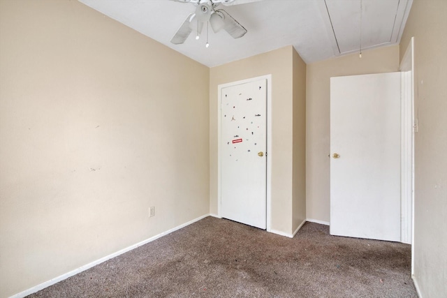 unfurnished bedroom with ceiling fan, vaulted ceiling, and dark colored carpet