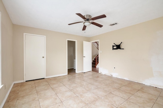 unfurnished bedroom featuring ceiling fan and light tile patterned floors