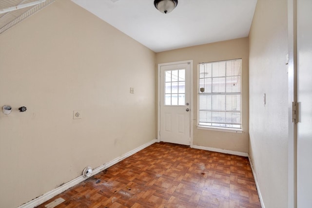 doorway with parquet flooring