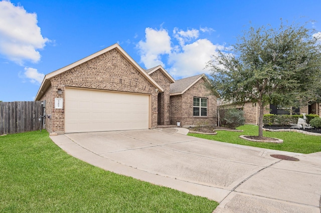 view of front of house with a front yard and a garage